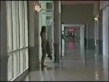 Female exhibitionist in a mall