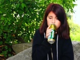  Drunked young girl drinking beer and shaking his head 